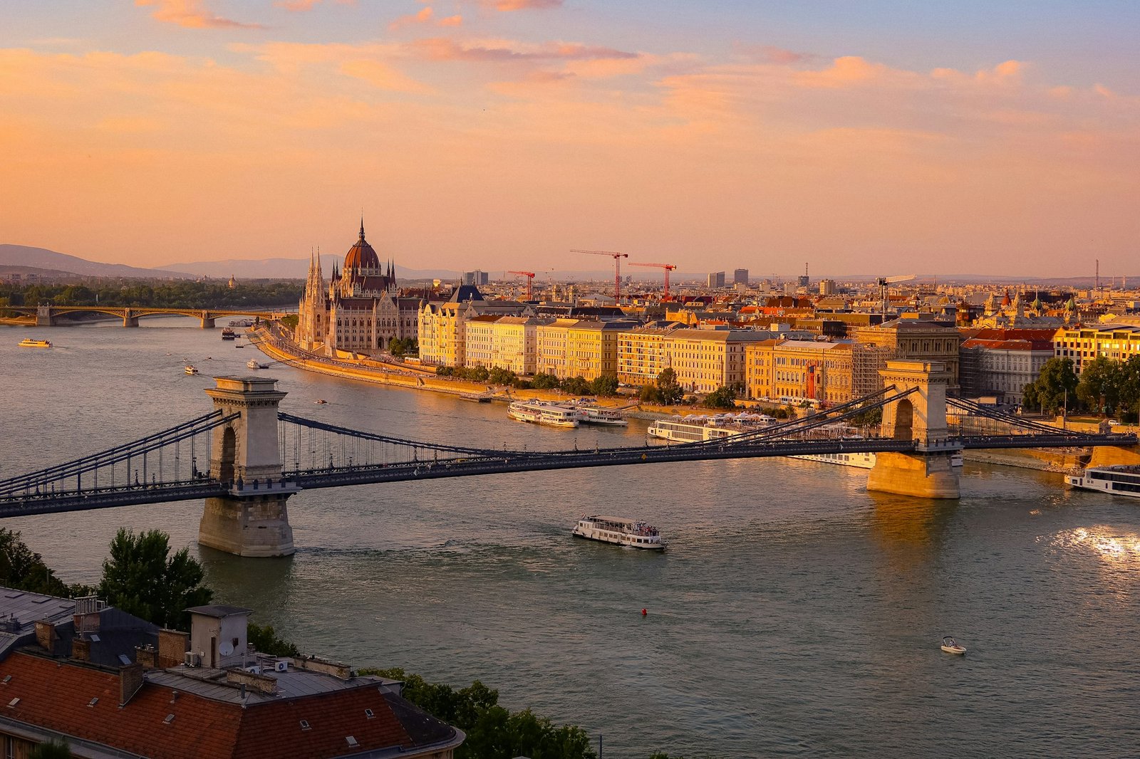 The Danube in Budapest at sunset, with the Parliament and a bridge across the river